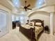 Spacious main bedroom features a tray ceiling, ceiling fan, and multiple windows at 1006 W Lake Hamilton Dr, Winter Haven, FL 33881