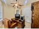 Cozy office space with a ceiling fan, classic desk, and built-in storage at 1006 W Lake Hamilton Dr, Winter Haven, FL 33881