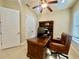 Office space with built-in shelving, ceiling fan, desk, and a comfortable chair at 1006 W Lake Hamilton Dr, Winter Haven, FL 33881