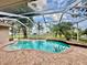 Inviting pool and screened patio with lake views at 1006 W Lake Hamilton Dr, Winter Haven, FL 33881