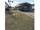 Metal carport for RV and car parking with grass yard at 1027 Bradbury Rd, Winter Haven, FL 33880