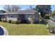 View of a spacious backyard with healthy green grass and chainlink fence at 108 Prospect Ave, Winter Haven, FL 33880