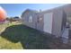 View of a spacious backyard with healthy green grass and chainlink fence at 108 Prospect Ave, Winter Haven, FL 33880