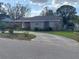 Charming single-story home with a well-maintained lawn and circular driveway at 108 Prospect Ave, Winter Haven, FL 33880