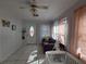 Bright living room featuring tile flooring, a decorative ceiling fan and natural light at 108 Prospect Ave, Winter Haven, FL 33880