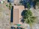Aerial view of a single story home showing the entire roof and surrounding trees at 1107 Saint Anne Shrine Rd, Lake Wales, FL 33898