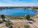 Aerial view of property with lake access and lush landscaping at 1107 Saint Anne Shrine Rd, Lake Wales, FL 33898