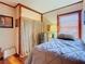 Comfortable bedroom featuring a cozy bed and window with natural light at 1107 Saint Anne Shrine Rd, Lake Wales, FL 33898