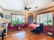 Inviting dining room featuring hardwood floors, natural light, and a charming corner cabinet at 1107 Saint Anne Shrine Rd, Lake Wales, FL 33898