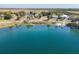 A serene lake view reflecting neighborhood homes and docks along the shore at 1107 Saint Anne Shrine Rd, Lake Wales, FL 33898