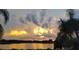 Stunning sunset over the tranquil lake, reflecting vibrant hues at 1107 Saint Anne Shrine Rd, Lake Wales, FL 33898