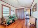 Living room with wooden trim, comfortable furnishings, and plenty of natural light at 1107 Saint Anne Shrine Rd, Lake Wales, FL 33898