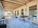 The porch has ample space for furniture and potted plants, perfect for outdoor enjoyment at 1107 Saint Anne Shrine Rd, Lake Wales, FL 33898