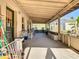 Spacious covered porch ideal for outdoor relaxation and entertaining at 1107 Saint Anne Shrine Rd, Lake Wales, FL 33898