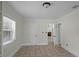 Bright bedroom boasts neutral walls, tiled floor, and natural light from a window at 1121 Sunset Dr, Lake Wales, FL 33853