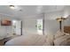 Bright bedroom with door to en-suite bathroom and an exterior door leading to the backyard at 1121 Sunset Dr, Lake Wales, FL 33853