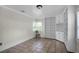 Bedroom with tile flooring and built in bookshelves with window for natural light at 1121 Sunset Dr, Lake Wales, FL 33853
