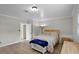 Bedroom with tiled floor, natural light, and a cozy bed at 1121 Sunset Dr, Lake Wales, FL 33853