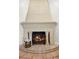 Elegant fireplace with decorative ironwork and tiled hearth at 1121 Sunset Dr, Lake Wales, FL 33853