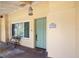 Inviting front porch with a decorative door, charming bench, and address number at 1121 Sunset Dr, Lake Wales, FL 33853