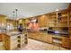 Gourmet kitchen with high-end appliances, custom cabinetry, and a center island with ample counter space at 1121 Sunset Dr, Lake Wales, FL 33853