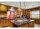Well-equipped kitchen featuring a center island, stainless steel appliances, and ample counter space at 1121 Sunset Dr, Lake Wales, FL 33853