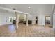 Bright living room featuring a fireplace and access to kitchen and dining areas at 1121 Sunset Dr, Lake Wales, FL 33853