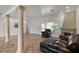 Cozy living room with fireplace, tile flooring, and ample natural light at 1121 Sunset Dr, Lake Wales, FL 33853