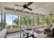 Sunroom with sliding glass doors, lake view and workout equipment at 1121 Sunset Dr, Lake Wales, FL 33853