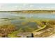 Scenic waterfront view with a private dock extending into the lake at 1121 Sunset Dr, Lake Wales, FL 33853