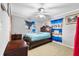 Bedroom with a wooden bed frame and blue curtains at 1330 Skyview Blvd, Lakeland, FL 33801