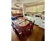 Cozy dining room with a glass-topped table, wooden chairs, and adjacent kitchen, perfect for Gathering meals at 1330 Skyview Blvd, Lakeland, FL 33801