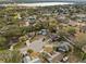 Aerial view of house near lake and residential area at 1406 Chamberlain Loop, Lake Wales, FL 33853