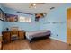 bedroom with light blue walls and wood floors at 1406 Chamberlain Loop, Lake Wales, FL 33853