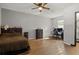 Generous bedroom with wood flooring and built-in dresser at 1406 Chamberlain Loop, Lake Wales, FL 33853