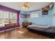 Bedroom with wood floors, window seating and a desk at 1406 Chamberlain Loop, Lake Wales, FL 33853