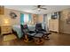Main bedroom with two armchairs and a dresser at 1406 Chamberlain Loop, Lake Wales, FL 33853