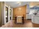 Bright dining room with wood table and access to the kitchen at 1406 Chamberlain Loop, Lake Wales, FL 33853
