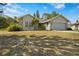 One-story house with attached garage and landscaping at 1406 Chamberlain Loop, Lake Wales, FL 33853