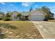 Single story house with stone facade and driveway at 1406 Chamberlain Loop, Lake Wales, FL 33853