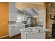 Modern kitchen with white cabinets and a marble countertop at 1406 Chamberlain Loop, Lake Wales, FL 33853