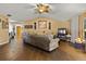 Living room with tile floors, a ceiling fan, and ample natural light at 1406 Chamberlain Loop, Lake Wales, FL 33853