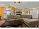 Spacious living room featuring a stone fireplace and comfortable seating at 1406 Chamberlain Loop, Lake Wales, FL 33853