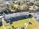 Aerial view of a waterfront apartment building with lush landscaping at 1600 W Lake Parker Dr # C25, Lakeland, FL 33805