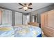 Comfortable bedroom with ceiling fan and large closet at 1600 W Lake Parker Dr # C25, Lakeland, FL 33805