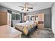 Comfortable bedroom with ceiling fan and large closet at 1600 W Lake Parker Dr # C25, Lakeland, FL 33805
