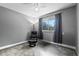 Bright bedroom with gray walls, carpet flooring, and a window with curtains at 1600 W Lake Parker Dr # C25, Lakeland, FL 33805