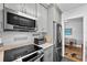 Modern kitchen with stainless steel appliances and granite countertops at 1600 W Lake Parker Dr # C25, Lakeland, FL 33805