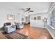 Spacious living room with hardwood floors and access to dining area at 1600 W Lake Parker Dr # C25, Lakeland, FL 33805