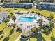 Community pool with surrounding patio and lounge chairs at 1600 W Lake Parker Dr # C25, Lakeland, FL 33805
